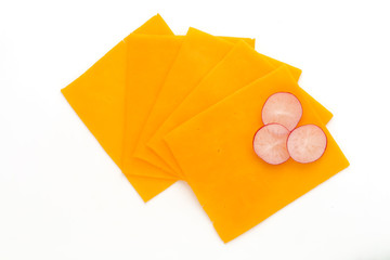 Cheddar cheese slice isolated on the white background.