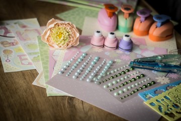 set for needlework on wooden table.