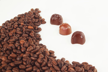 frame for text from grains of black coffee and chocolates
