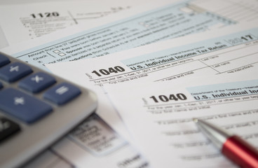 Naklejka premium U.S. Individual income tax return. tax form 1040. Tax form business financial concept