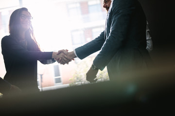 Businesspeople hand shake after a deal
