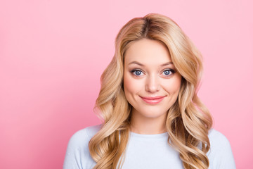 Portrait of friendly sweet girl in casual outfit with modern hairdo big eyes looking at camera isolated on pink background