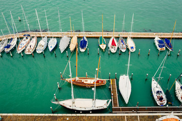Aerial view on yachts on the pier. Mediterranean sea with boats in harbour.