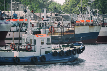 FISHING PORT - Fishing boats at the wharf and sailing pilot boat   © Wojciech Wrzesień