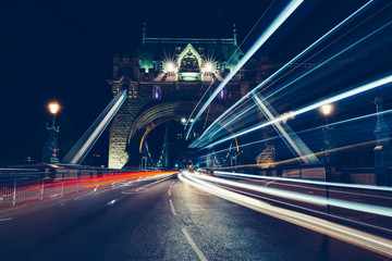 City light trails of traffic on Tower Bridge London at night