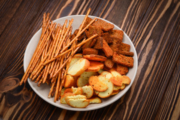 Snacks on a wooden background. Space for text or design.
