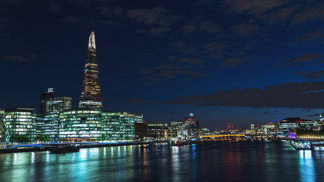 Panoramic view of London skyline at night on River Thames