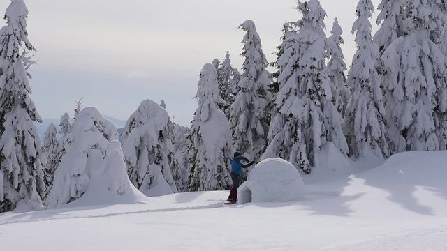 Snow igloo building in the high mountain. Winter video