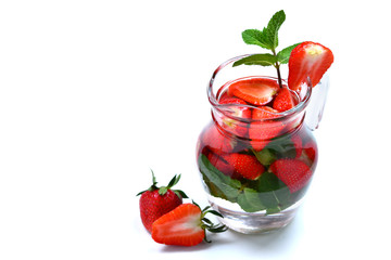 Summer fresh fruit flavored infused water of strawberry and mint. Space for test or design.