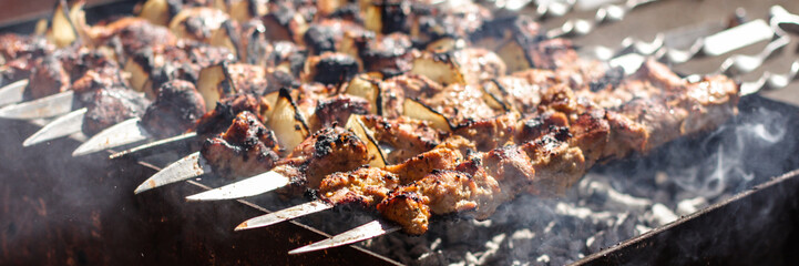 barbecue shish kebab on skewers fry (meal outdoors) - cuisine.  Food background