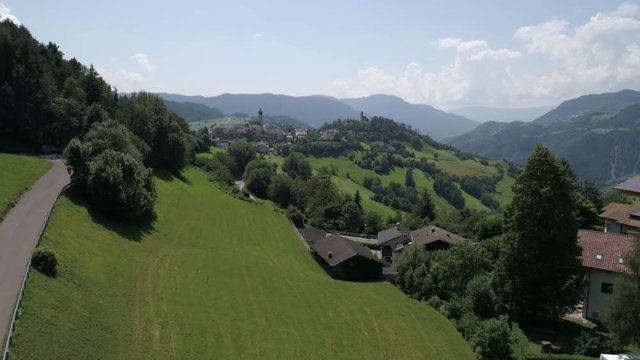 Aerial drone video of the city of V&ouml;ls am Schlern Fi&eacute; allo Sciliar  on the Italian Alps Dolomites 