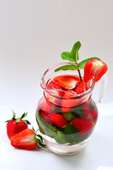 Summer fresh fruit flavored infused water of strawberry and mint. Space for test or design.