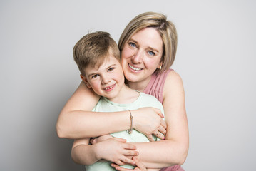 Mother and son on studio white background