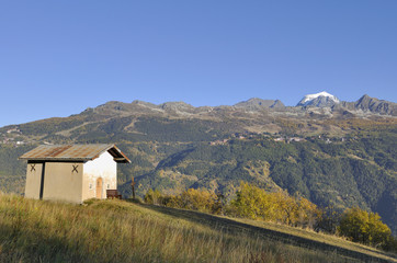  little chapel in mountain under blue sky