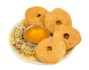 Indian Traditional Sweet Kachori Also Know As Mawa Kachori, Kachauri or Kachodi, Stuffed Kachori With Condensed Milk, Cheese and Dry Fruits And Served With Sugar Syrup isolated on White Background