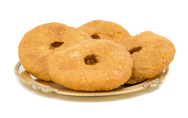 Indian Traditional Sweet Kachori Also Know As Mawa Kachori, Kachauri or Kachodi, Stuffed Kachori With Condensed Milk, Cheese and Dry Fruits And Served With Sugar Syrup isolated on White Background