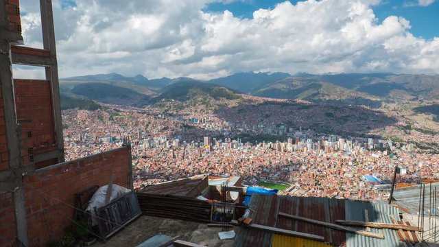 Timelapse of the city of La Paz during sunny day with clouds and construction on the foreground. Bolivia