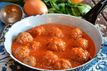 Meatballs in tomato sauce in a rustic pan