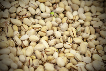 Pistachio nuts background. View from above.