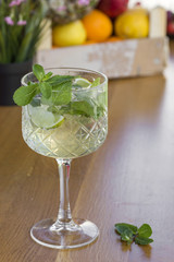 Cocktail with vodka, mint and lemon in glass