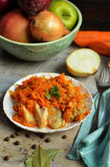 Fish in greek on rustic white plate