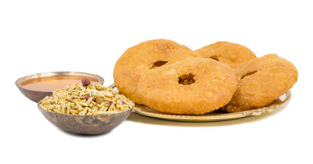 Indian Traditional Sweet Kachori Also Know As Mawa Kachori, Kachauri or Kachodi, Stuffed Kachori With Condensed Milk, Cheese and Dry Fruits And Served With Sugar Syrup isolated on White Background