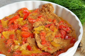 Pork chop in a sauce with peppers