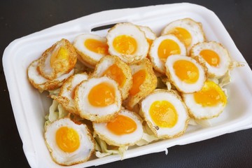 fried quail egg on foam dish