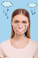 Unfair world. Portrait of upset girl standing in front of you and crying while having plastered...