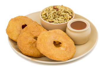 Indian Traditional Sweet Kachori Also Know As Mawa Kachori, Kachauri or Kachodi, Stuffed Kachori With Condensed Milk, Cheese and Dry Fruits And Served With Sugar Syrup isolated on White Background