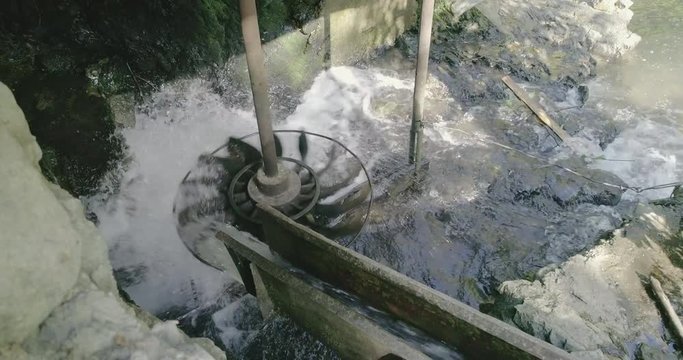 Water mill wheel turning. Old water mill working in Transylvania, Romania