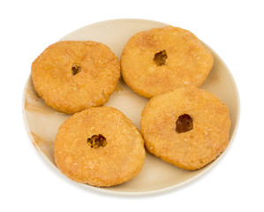 Indian Traditional Sweet Kachori Also Know As Mawa Kachori, Kachauri or Kachodi, Stuffed Kachori With Condensed Milk, Cheese and Dry Fruits And Served With Sugar Syrup isolated on White Background