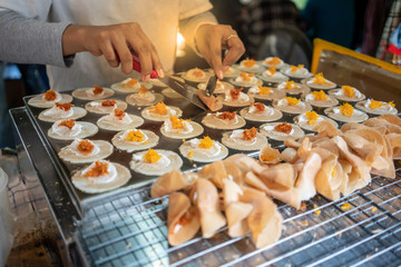 Obraz na płótnie Canvas Thai Traditional Snack and Dessert. Thai Crispy Crepes Filled with Cream.