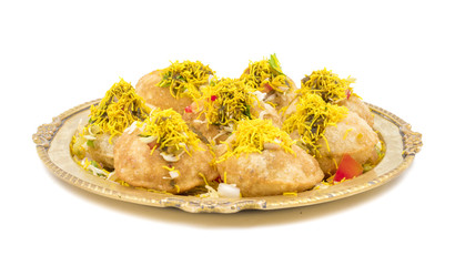 Indian Spicy Chaat Item Sev Puri Stuffed With Potato, Sev Namkeen, Coriander, Chutney isolated on White Background. It is a Most Popular Snack of Mumbai, Maharashtra