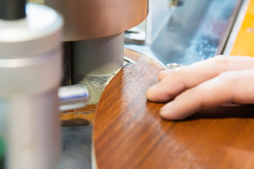 Close-up Carpenter works for Edge Banding Machine In workshop