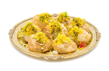 Indian Spicy Chaat Item Sev Puri Stuffed With Potato, Sev Namkeen, Coriander, Chutney isolated on White Background. It is a Most Popular Snack of Mumbai, Maharashtra