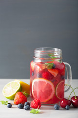 summer berry lemonade with lime and mint in mason jar