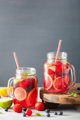 summer berry lemonade with lime and mint in mason jar