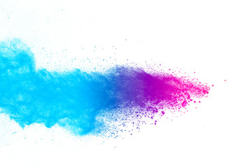 Obraz premium Multi color powder explosion on white background. Launched colorful dust particles splashing.