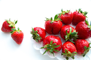 Strawberry scattered on a white background isolate