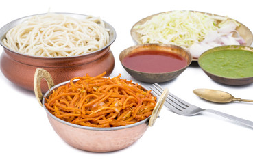 Spicy Fried Vegetable Veg Chow Mein Served With Green And Red Chutney Also Know as Noodles or Hakka Noodles is a Popular Oriental Dish With Noodles And Vegetables isolated on White Background