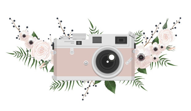 Vintage retro photo camera in flowers, leaves, branches on white background