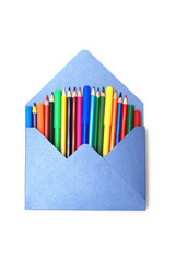 Colored Pencils in blue envelope Isolated on White Background Copy Space School Suplies