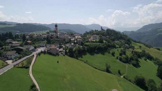 Aerial drone video of the city of V&ouml;ls am Schlern Fi&eacute; allo Sciliar  on the Italian Alps Dolomites 