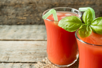 Red cocktail with tomato juice, Basil and salt, selective focus