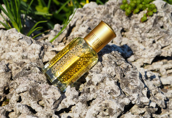 Arabian oud attar perfume or agarwood oil fragrances in mini bottle.