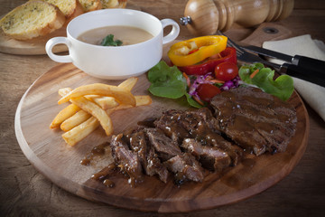 Black pepper steak Served with Garlic Bread and Mushroom Soup