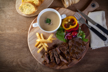 Black pepper steak Served with Garlic Bread and Mushroom Soup