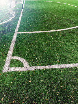 Corner of the football field. White markings on green grass. Easy toning.
