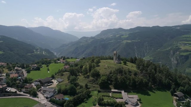 Aerial drone video of the city of V&ouml;ls am Schlern Fi&eacute; allo Sciliar  on the Italian Alps Dolomites 